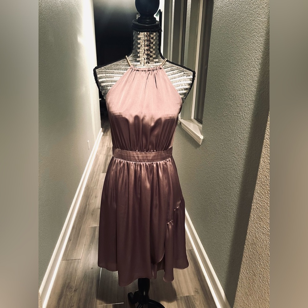 Elegant silk look dress with a flowing skirt perfect for those warm days.